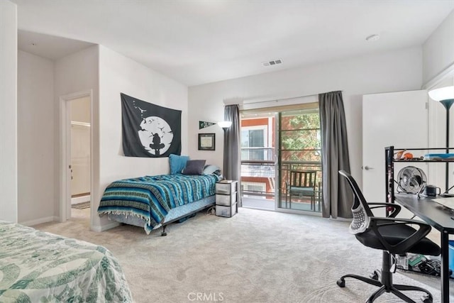 bedroom featuring access to exterior, visible vents, and carpet flooring