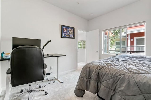 bedroom featuring carpet floors and baseboards