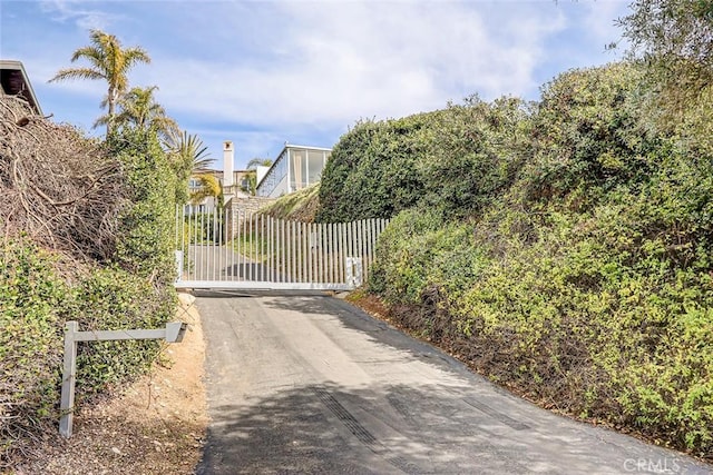 view of gate with fence