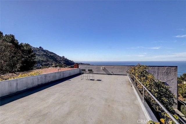 view of patio / terrace featuring a water view