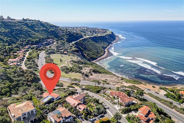 birds eye view of property with a water view and a residential view