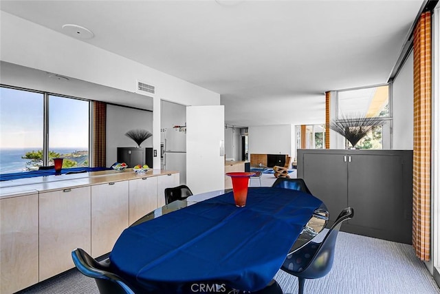 dining room featuring visible vents