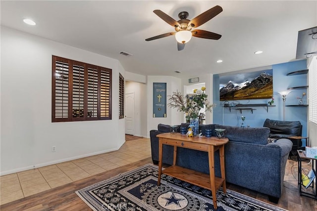 living room with visible vents, baseboards, ceiling fan, and recessed lighting