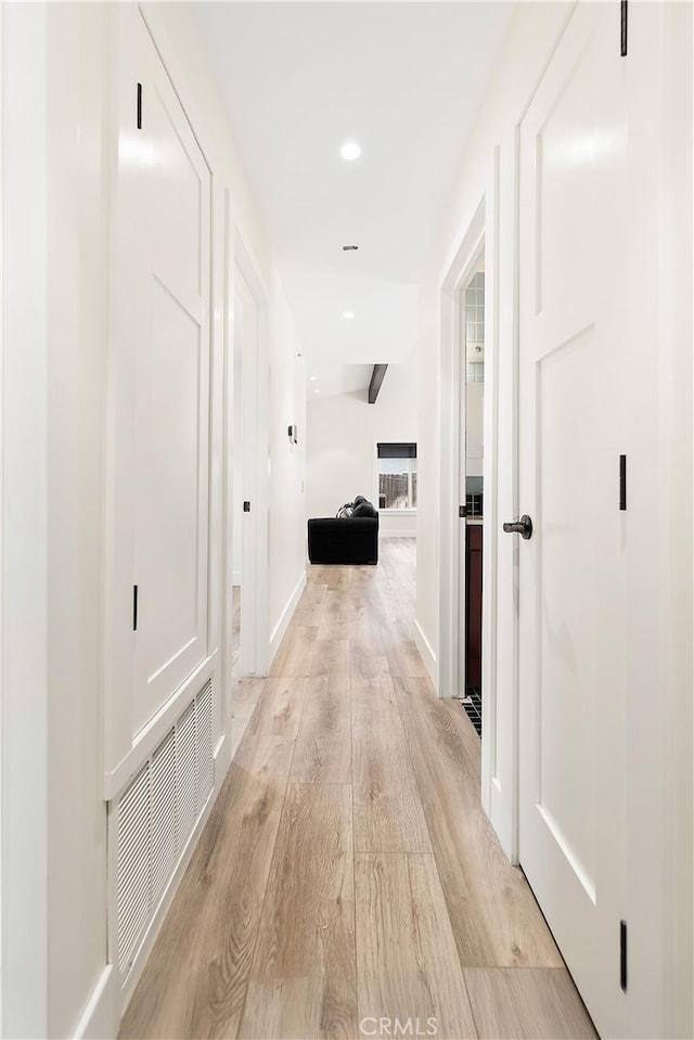 hall featuring recessed lighting, visible vents, and light wood-style flooring