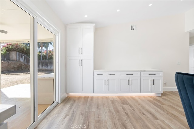 interior space with visible vents, baseboards, light wood-style flooring, and recessed lighting