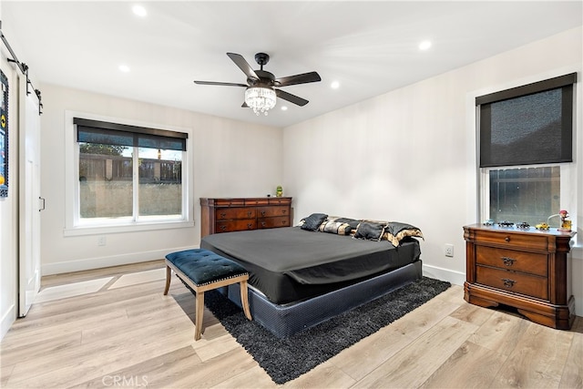 bedroom with ceiling fan, light wood finished floors, recessed lighting, and baseboards