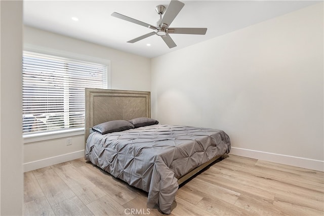 bedroom featuring recessed lighting, light wood-style flooring, and baseboards