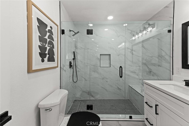 full bath featuring toilet, recessed lighting, a marble finish shower, and vanity