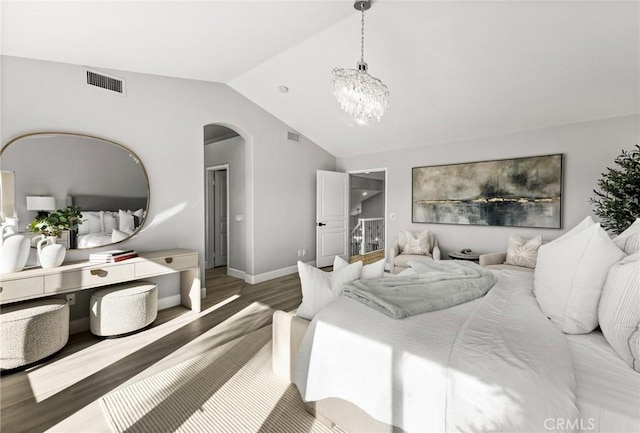 bedroom with arched walkways, lofted ceiling, a notable chandelier, visible vents, and dark wood-style floors