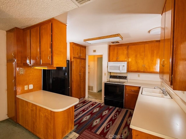 kitchen featuring light countertops, brown cabinetry, a sink, white appliances, and a peninsula