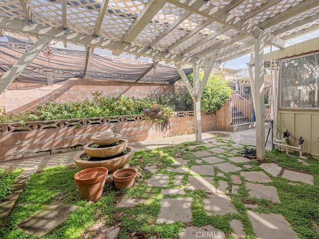 view of patio / terrace with fence and a pergola