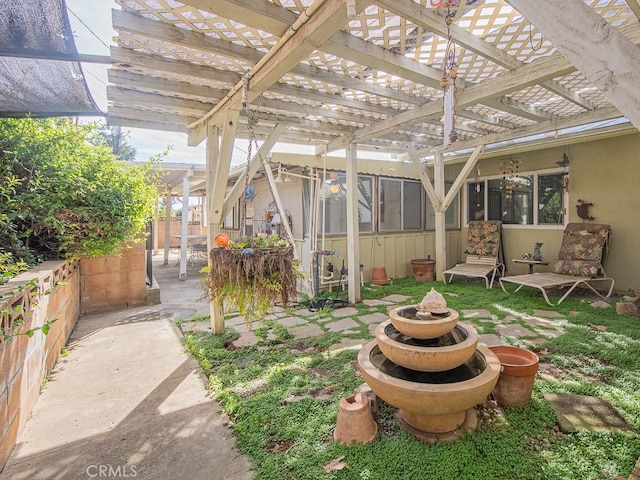 view of yard featuring fence and a pergola