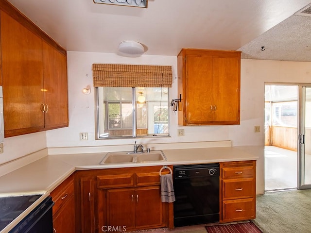 kitchen with a sink, a healthy amount of sunlight, light countertops, and dishwasher