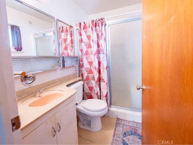 full bath featuring toilet, a walk in shower, and vanity