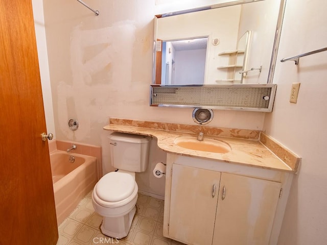 bathroom with vanity, toilet, and a bath