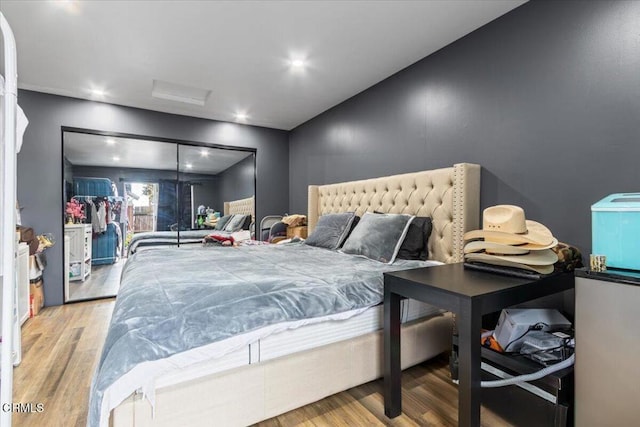 bedroom featuring wood finished floors