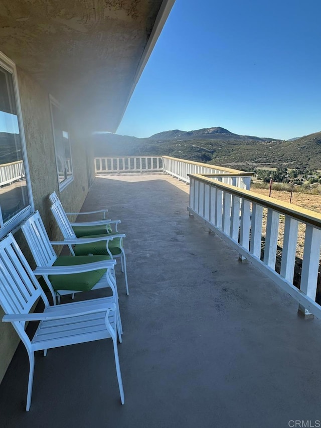 balcony featuring a mountain view