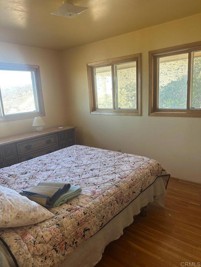 bedroom with wood finished floors