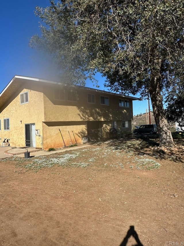 exterior space with stucco siding