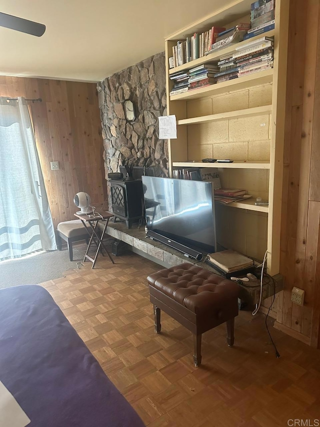 living area featuring wood walls