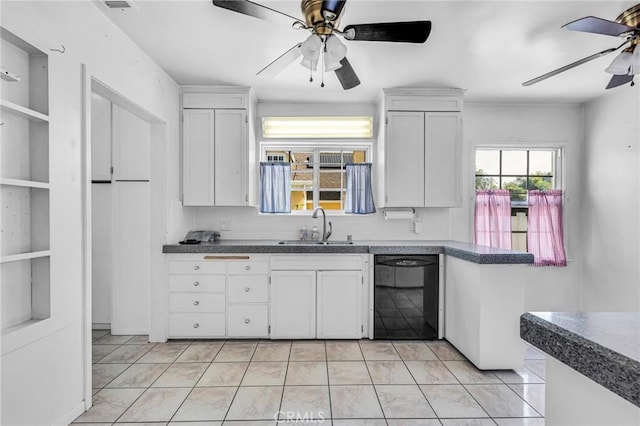 kitchen featuring black dishwasher, dark countertops, a ceiling fan, white cabinets, and a sink