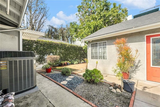 view of yard with a patio area, cooling unit, and fence