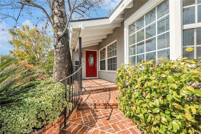 doorway to property with stucco siding