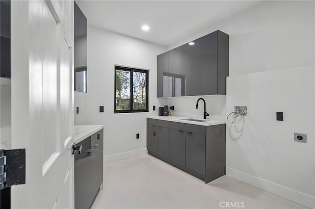 bathroom with recessed lighting, vanity, and baseboards