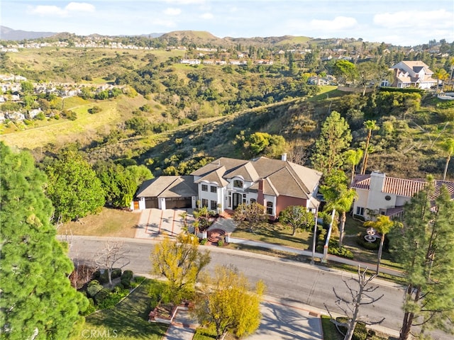 drone / aerial view featuring a mountain view