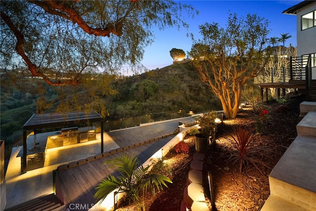 exterior space featuring a deck with mountain view