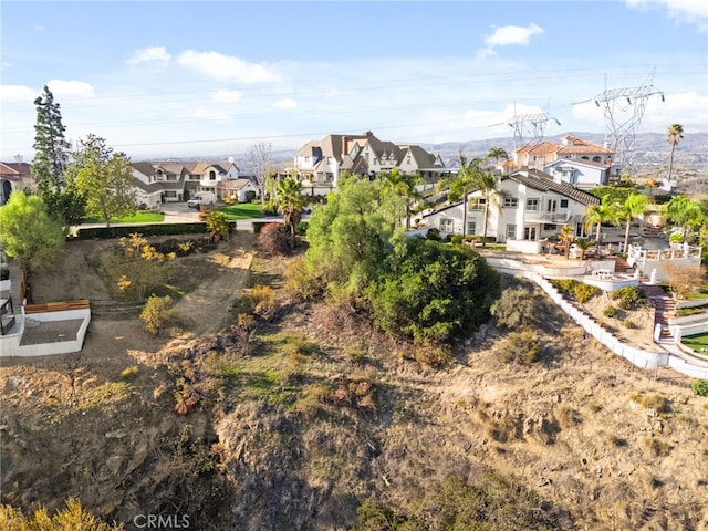 birds eye view of property with a residential view