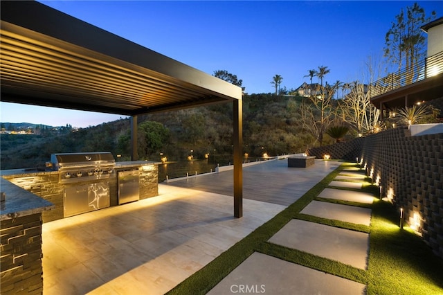 view of patio / terrace featuring a mountain view, grilling area, and area for grilling