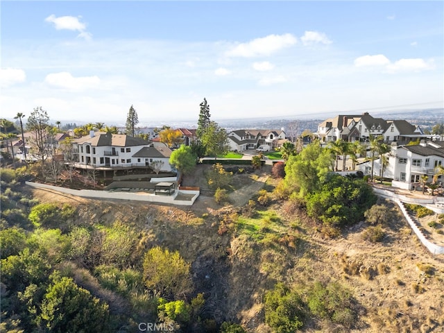 birds eye view of property with a residential view