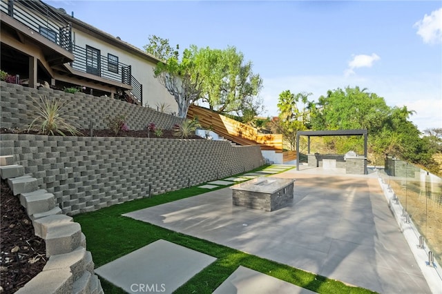 exterior space featuring a fire pit and a fenced backyard