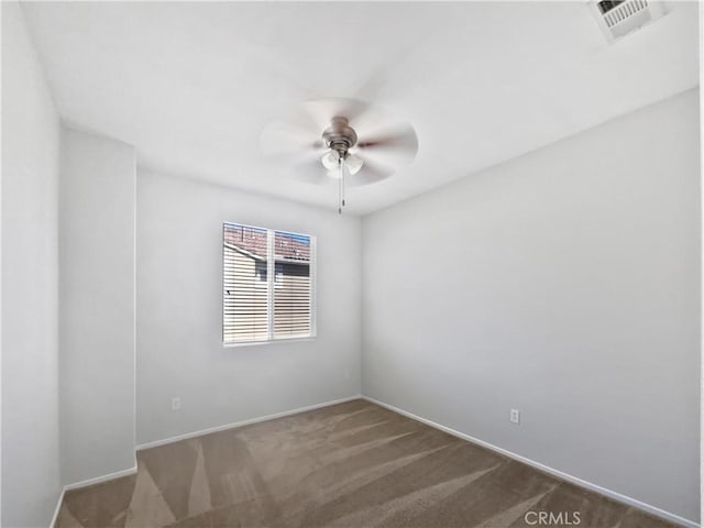 unfurnished room with carpet flooring, ceiling fan, and visible vents