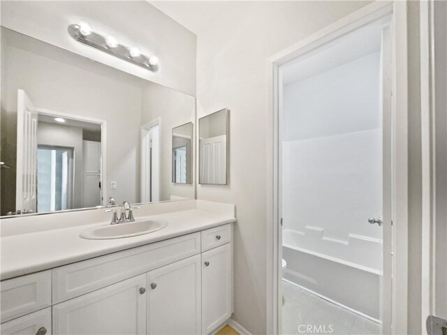 bathroom with toilet and vanity