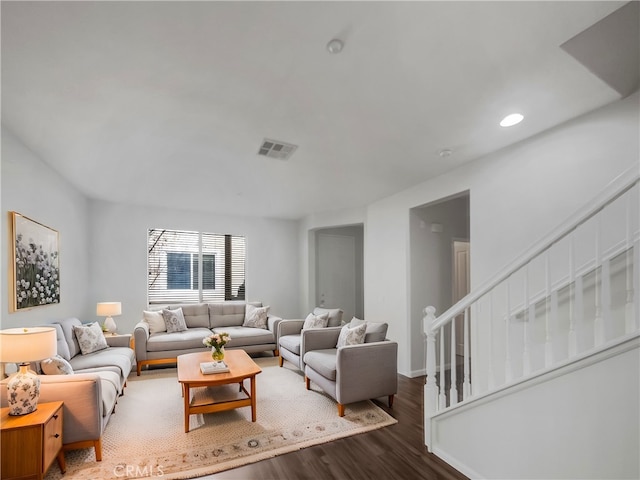 living area with stairway, dark wood-style flooring, visible vents, and recessed lighting