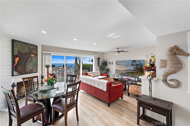 dining room featuring recessed lighting, ceiling fan, a textured ceiling, and light wood finished floors