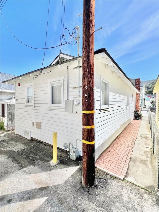 view of property exterior featuring fence