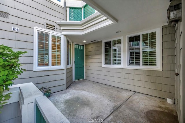 doorway to property featuring a patio area