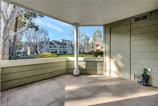 view of patio with a residential view and visible vents