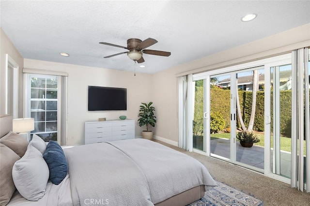 carpeted bedroom featuring access to exterior, recessed lighting, a textured ceiling, and baseboards