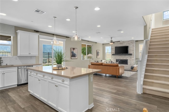 11781 Stonefield Dr, Corona, CA 92883 - kitchen with dark wood-type flooring, dishwasher, a sink, and a ceiling fan