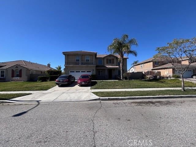 view of front facade featuring driveway, a front lawn, an attached garage, and a residential view