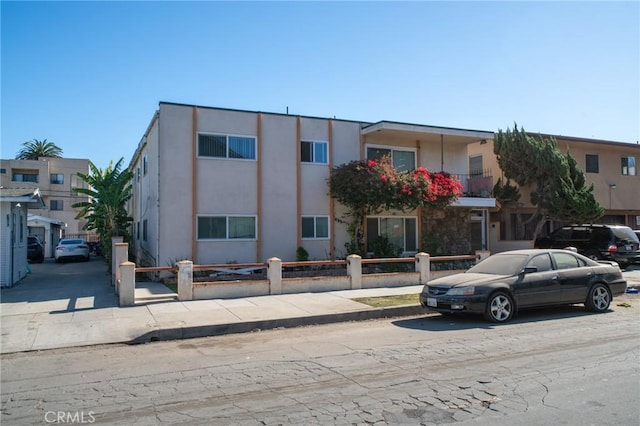 view of building exterior with a fenced front yard