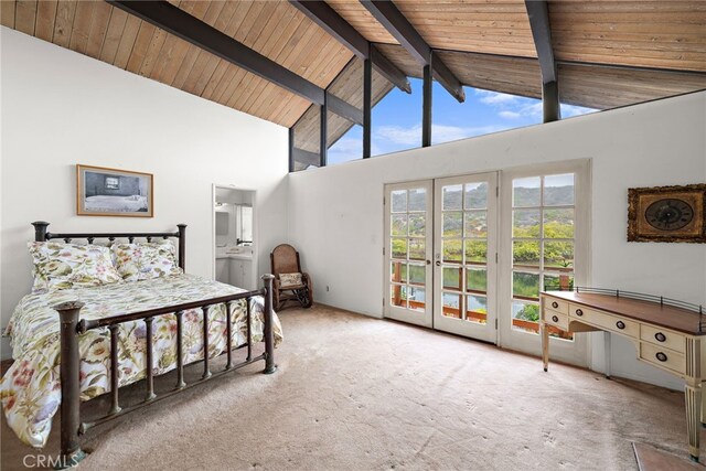 bedroom with carpet floors, access to exterior, beam ceiling, and french doors