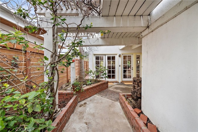 view of patio / terrace with french doors and fence