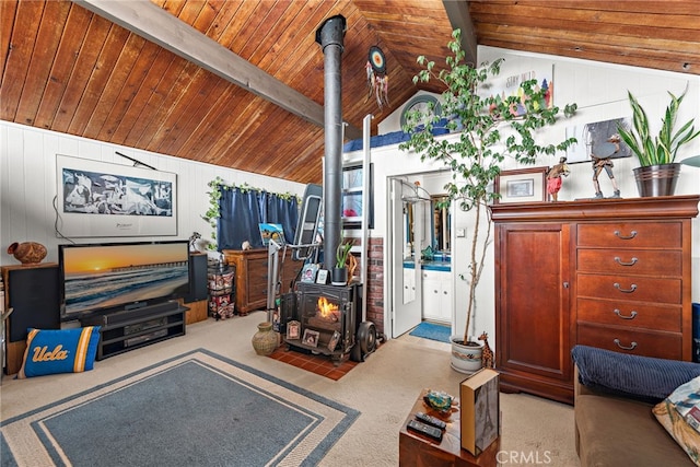living room featuring carpet flooring, wood ceiling, lofted ceiling with beams, and a wood stove
