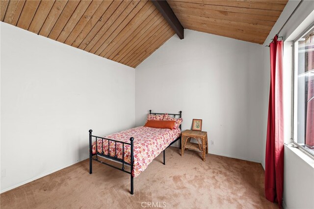 bedroom featuring wood ceiling, carpet, and vaulted ceiling with beams