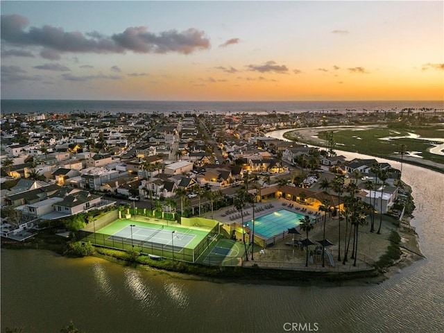 476 62nd St, Newport Beach, CA 92663 - aerial view at dusk of a water view, view of pool, and a residential view